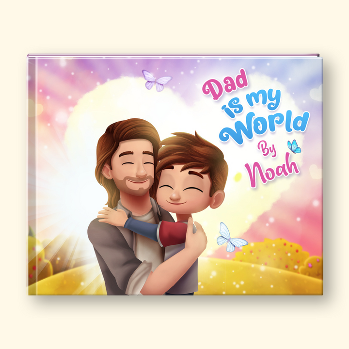 A personalized hardcover book cover featuring a colorful illustration of a father and son hugging, with the text 'Dad is my World By Noah' written in playful pink and blue lettering. The book is shown standing upright against a light cream background.