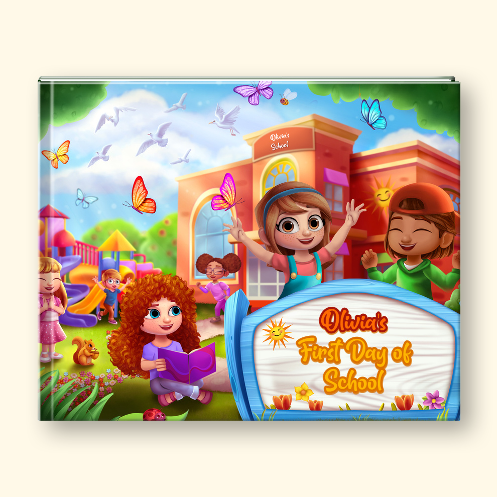 A custom printed hardcover book cover featuring a colorful cartoon illustration of children celebrating school with a schoolhouse, playground, butterflies, and a large sign reading 'OLIVIA'S First Day of School.' A small matching illustrated girl stands in front of the book on a white background.
