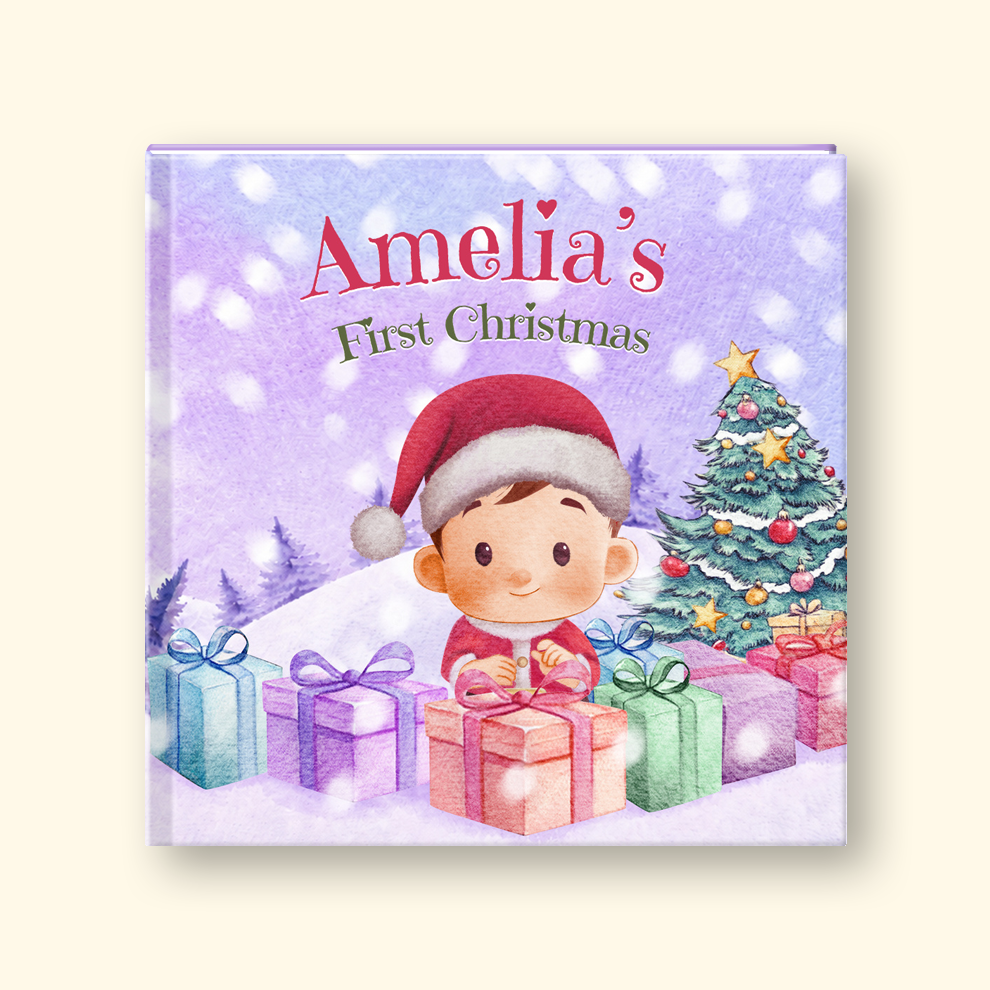 A square hardcover children's book cover featuring a watercolor illustration of a child in a Santa hat surrounded by Christmas presents, a decorated tree, and falling snow. The title reads 'Amelia's First Christmas' in red and green text on a lavender background.
