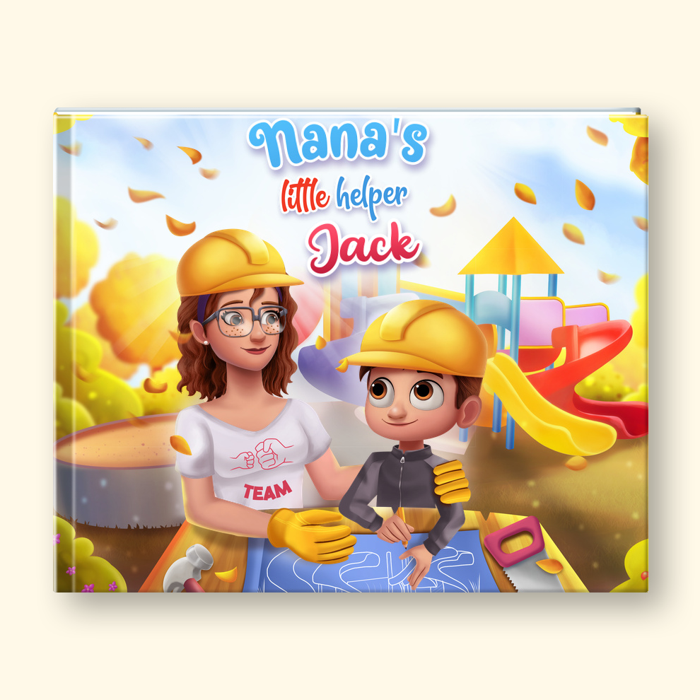 A hardcover children's book titled 'Nana's Little Helper Jack' shown on a white background, with a small illustrated version of the boy standing beside it. The cover art depicts a woman and a young boy wearing yellow hard hats in a colorful playground scene, while the illustrated figure wears gray clothing.