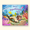 A hardcover children's book cover featuring a colorful underwater illustration with the title 'Olivia's Magical Underwater Adventure'. The cover shows a cartoon girl in a diving helmet, a sea turtle, a manta ray, a seahorse, and tropical fish in shades of blue, purple, pink, yellow, and green.